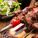 A lamb kebab on a skewer, with salad. Image: HLPhoto - stock.adobe.com