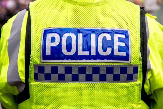 Man arrested after female police officer stabbed in the neck in ...