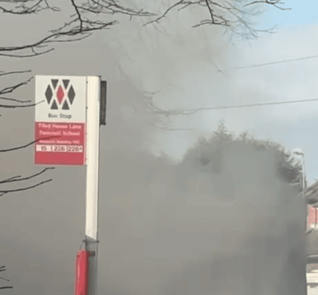 The bus was seen completely covered in smoke as firefighters worked tackled the blaze