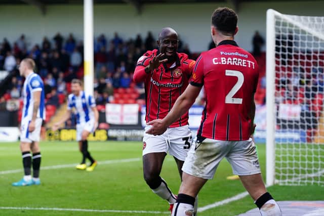 Albert Adomah celebrates his goal during Walsall's 4-0 win over Colchester last season.