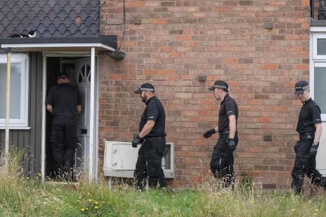 Officers at an address in Caddick Crescent after the baby's death.