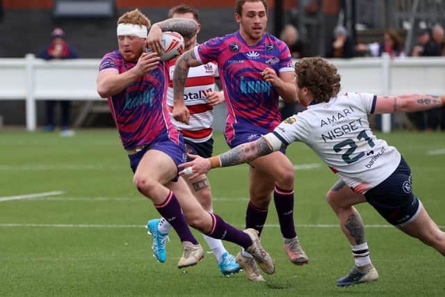 It was a tough game, with Ryan Johnson among those showing the scars of battle. Photo: Andy Shaw