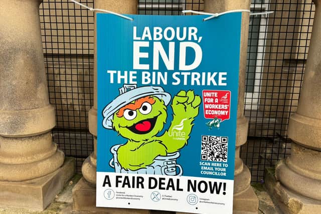 Bins strike protest signs outside Birmingham Council House on February 24. Credit: Alexander Brock