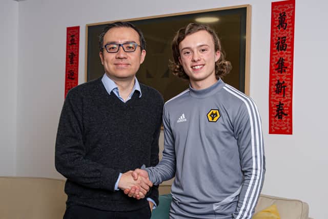 Matheson with Jeff Shi having signed for Wolves (Credit: Wolves)