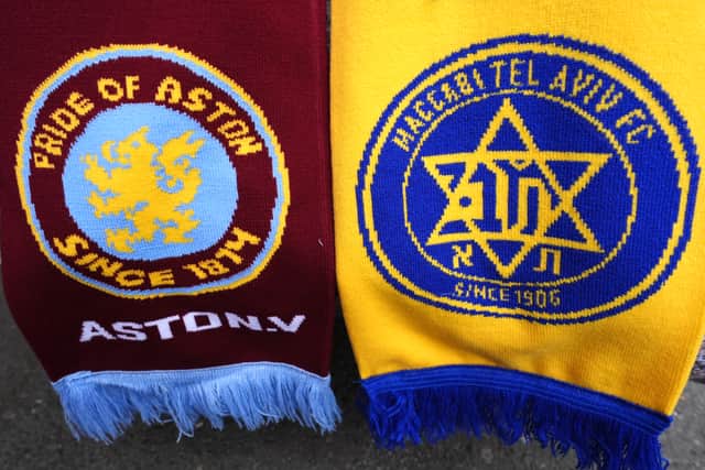 Aston Villa and Maccabi Tel Aviv club badges on a scarf.  