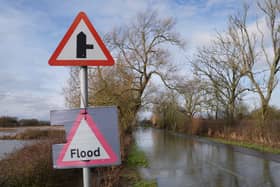 A flood warning sign on a flooded road. Picture date: Monday February 9, 2026. (Joe Giddens/PA)