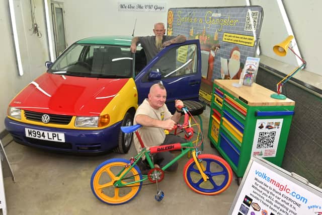 Lee Southerton (Magic) and with the beard: Mark Bradley (Brad), are pictured with three special custom prizes