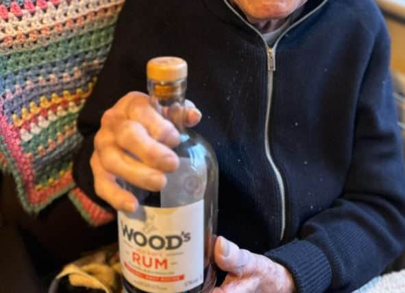 Joe Bullock pictured the day before his 101st birthday, celebrating with a bottle of rum