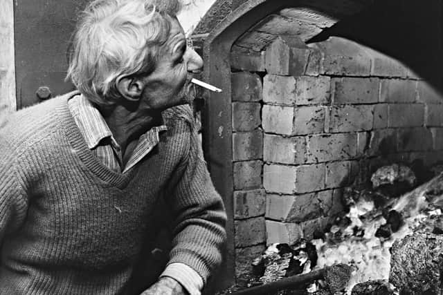 Frederick Law and Sons, maltsters, Wombourne: 'Malting is a seven-day a week job for Will Chambers  - and so is stoking up the furnaces that heat the kilns' - November 1970.