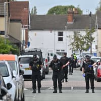 Gunman caught on shop CCTV and Ring doorbell shooting two men in Wolverhampton as car alarm blared