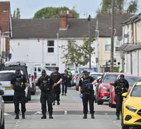 Police search the murder scene in Leicester Street, Wolverhampton in September last year