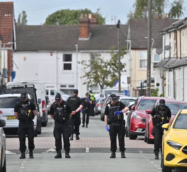 Police search the murder scene in Whitmore Reans in September last year