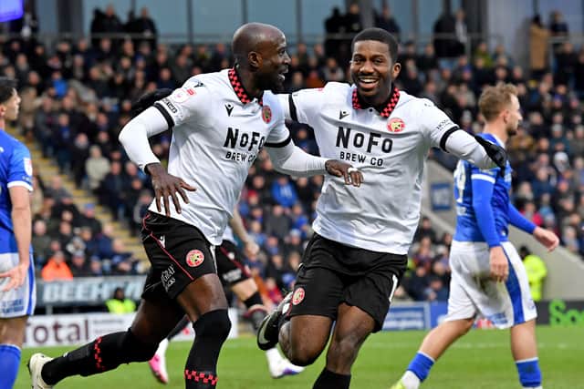 Albert Adomah rescued a point for Walsall as they came from two goals down to draw at Chesterfield on Saturday.