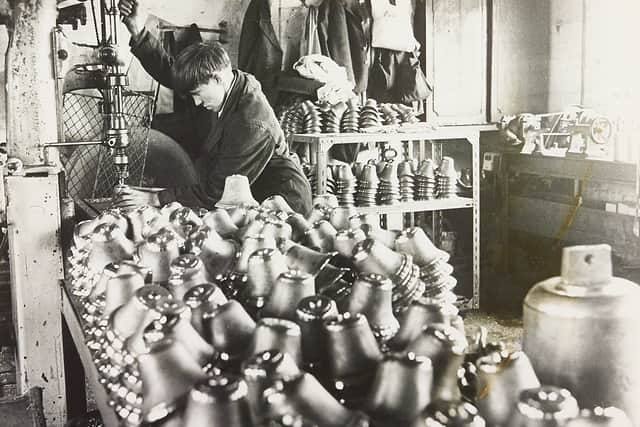 Edwin Preston, bell-makers, Jenner Street, Wolverhampton, June 1970: 'A mountain of hand bells ready for drilling by 16-year-old Malcolm Shaw of Bilston.'