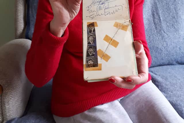Elizabeth Salt with her autograph album