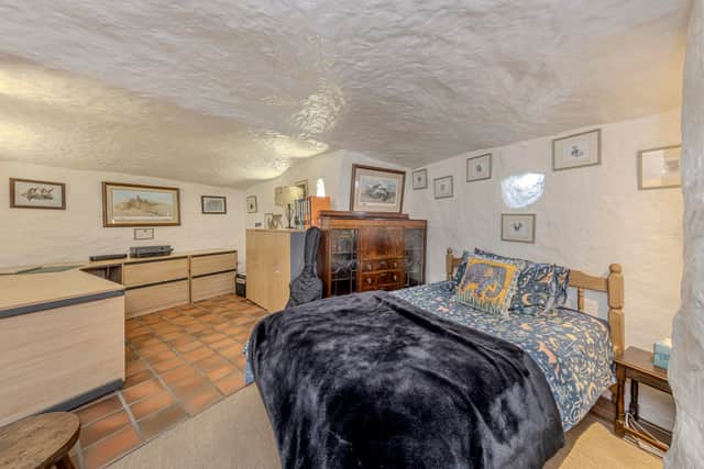 A stunning 16th-century West Midlands cottage built into a carved-out cave has gone on sale