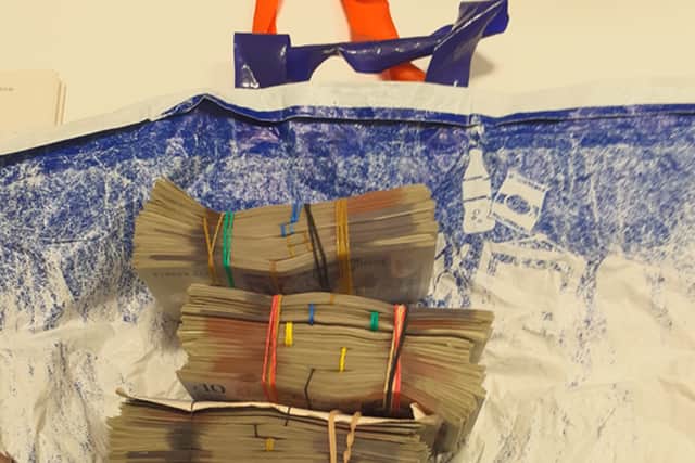 £15,000 and the bag Sajid Nawaz carried in to the Post Office
