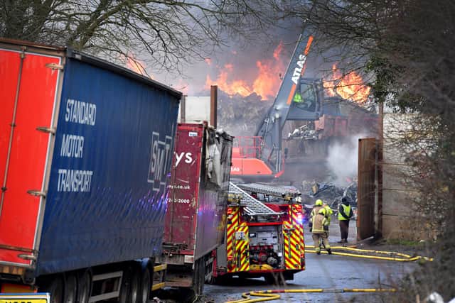The scene in Oak Lane, Kingswinford as firefighters tackle a scrapyard fire.