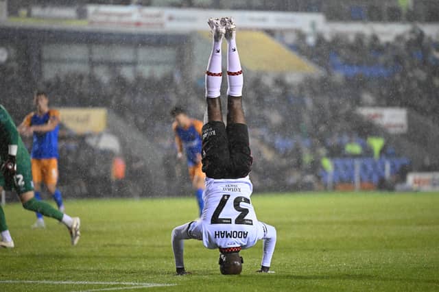 Walsall attacker Albert Adomah celebrating his 100th club career goal in a group stage win at Shrewsbury. (Image by Owen Russell)