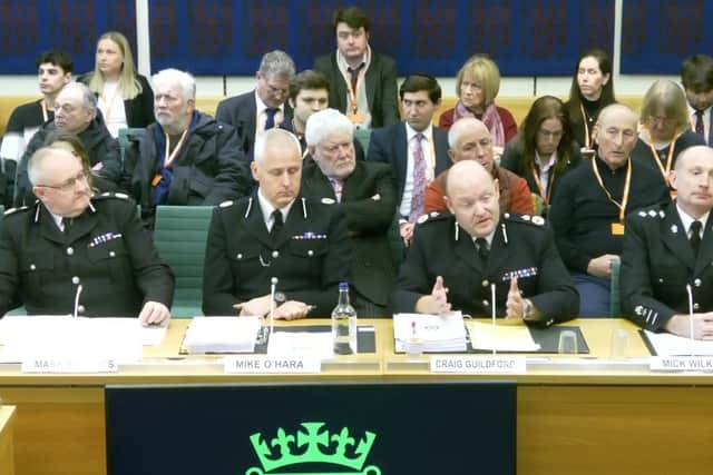 Chief Constable of West Midlands Police, Craig Guildford, second right, and assistant chief constable, Mike O'Hara, second left, appear before the home affairs committee.