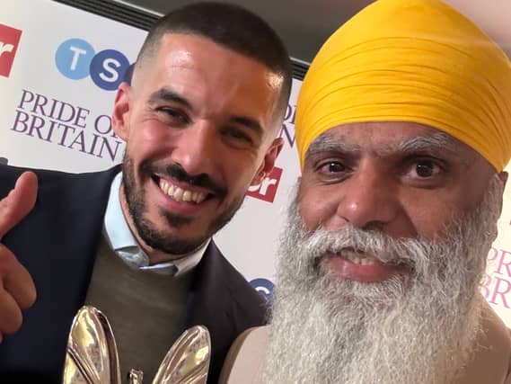 Manny won a Pride of Britain award and received congratulations from former Wolves captain Conor Coady. Photo: Manny Singh Kang