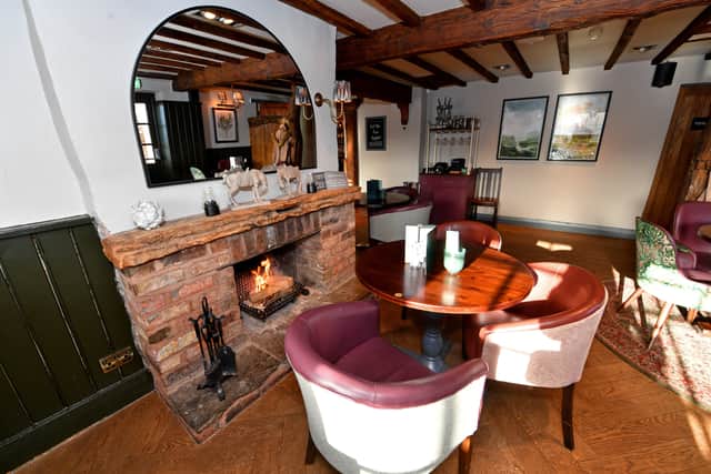 A warm fire place welcomes visitors to the Vine