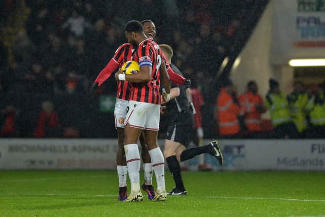 Daniel Kanu celebrates his equaliser with Jamille Matt during Walsall's defeat to Oldham.