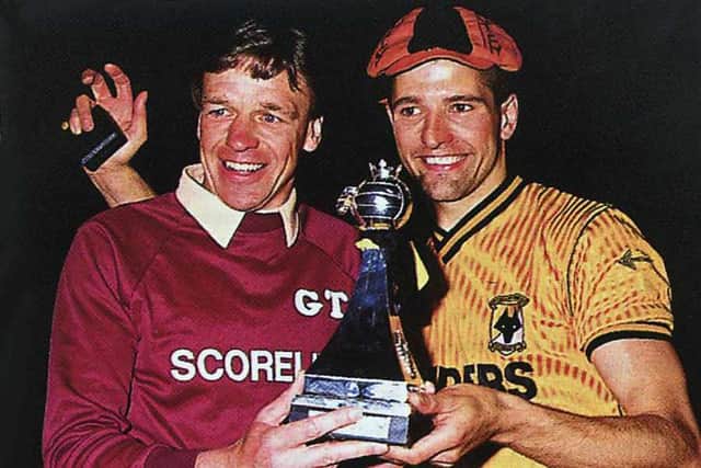 Graham Turner and Steve Bull celebrate with the Fourth Division trophy