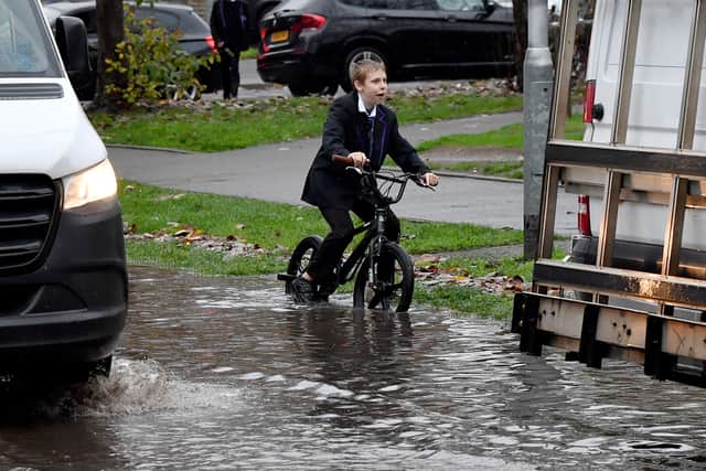 'Flood warnings issued after heavy rain hits region' - heavy rain took its toll on waterways and rivers across the region in November. Here we see a schoolboy bravely battling the elements along Primrose Avenue in Walsall.