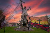 'Poppies light up island ahead of Remembrance Day' - the Jigger 'Miner' Island, near Brownhills High Street, decorated with poppies.