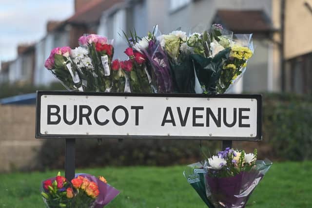 Flowers were left on the sign at the entrance to Burcot Avenue