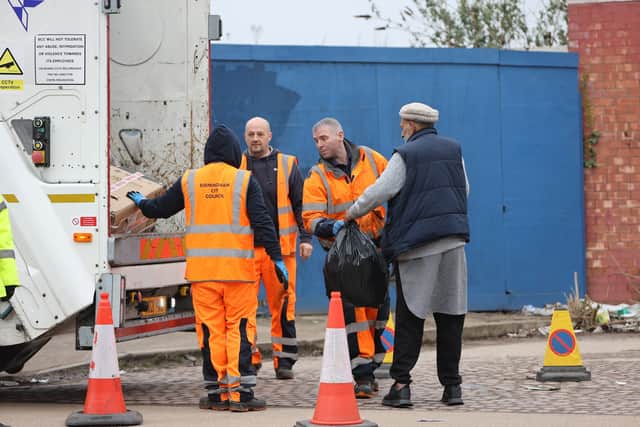 People dispose of their rubbish using a mobile refuse collection service in Drews Lane Ward End, Birmingham. March 26 2025.