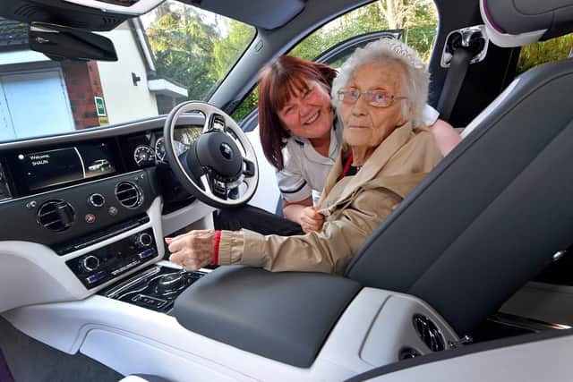Dorcas Dearne, aged 101, from The Cedars Nursing Home, Albrighton, in a Rolls Royce with nursing assistant Lara Blackshaw. Photo: Tim Thursfield