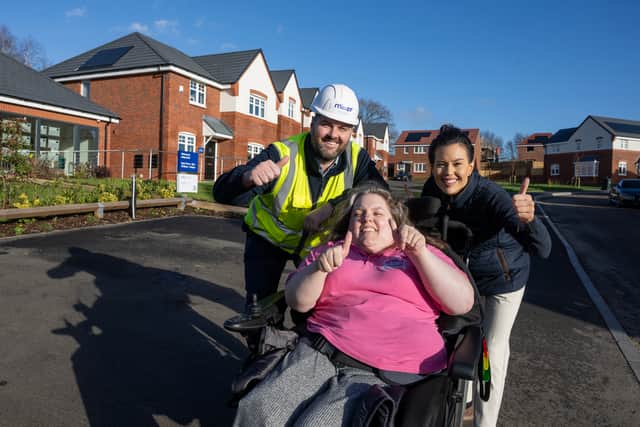 Ceri Davies BEM (centre) with Miller Homes staff at Astley Croft