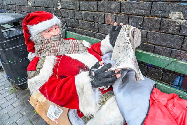 Father Christmas has showed up on a bench in Birmingham's Jewellery Quarter next to the Banksy mural. December 17 2025.
