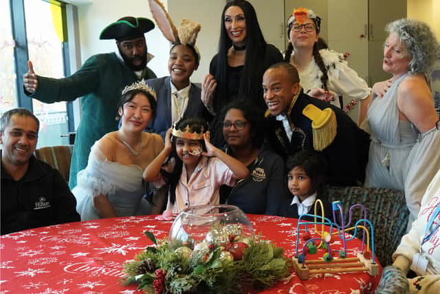Cast of BOA Group's Cinderella pose with families at Ronald McDonald House Birmingham