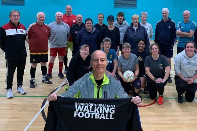 Put your shirt on Tim . . . Spartans walking footballers gather to support him in his 3,000-mile challenge.