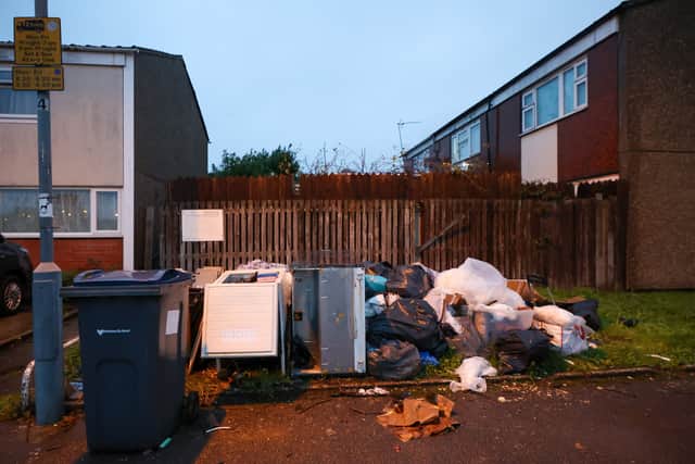 Rubbish piled up on Lawford Road in Birmingham. Birmingham agency bin workers attend rally on Smithfield depot in Birmingham on first day they join the strike with Birmingham City Council directly employed bin workers.