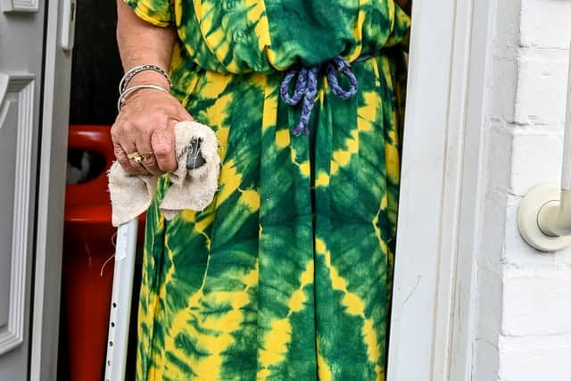 Doris Peynado, first resident on the street and is aged over 100.