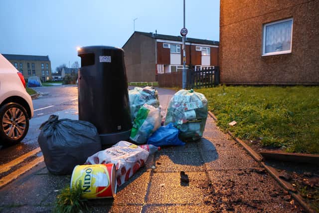Rubbish piled up on Lawford Road in Birmingham. Birmingham agency bin workers attend rally on Smithfield depot in Birmingham on first day they join the strike with Birmingham City Council directly employed bin workers.