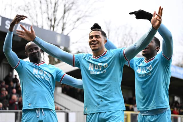 Priestley Farquharson celebrates scoring Walsall's second goal against Harrogate. (Owen Russell)