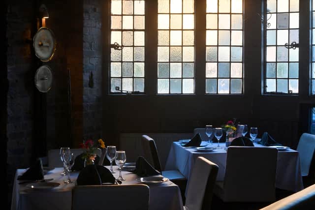 The stained glass windows of the old bank give the restaurant a distinctive feel