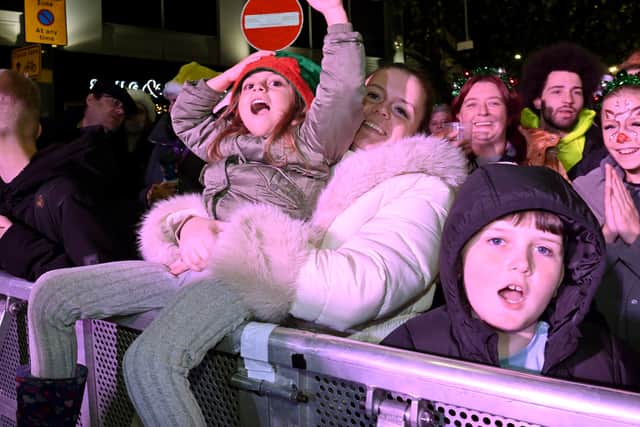 Delighted families cheer.