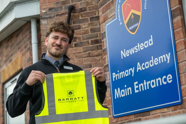 Head of School Jack Kinsey accepting Barratt Homes' donation
