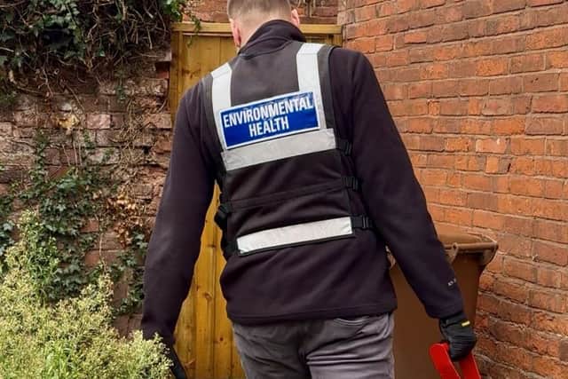 An Environmental Health officer from Lichfield District Council during the operation.  