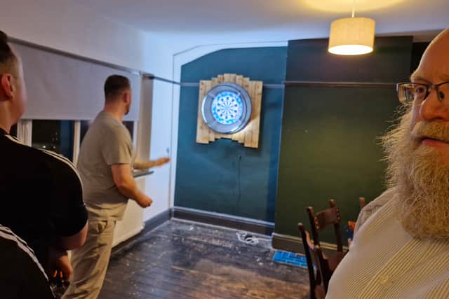 The darts room upstairs was busy with a full game going