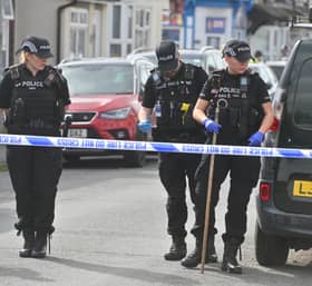 Police search the murder scene in Leicester Street, Wolverhampton in September last year