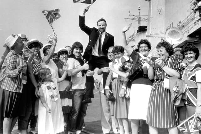 Chief Stoker Dave Tisdale gets a lift from his family and friends who traveled from West Bromwich and Walsall to welcome him home from the Falklands at Portsmouth in 1982.