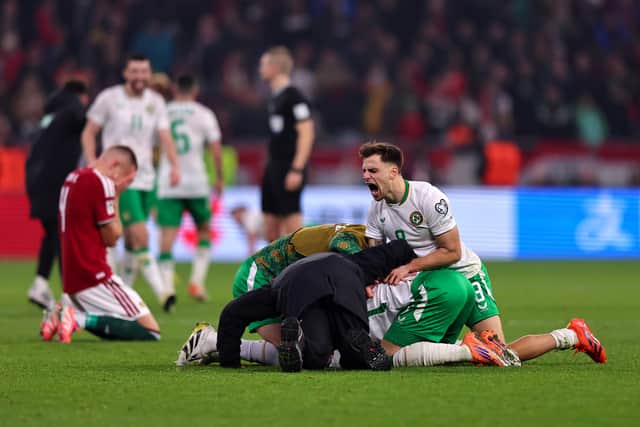 Jayson Molumby swamps hat-trick hero Troy Parrott at full-time.  (Photo by David Balogh/Getty Images)
