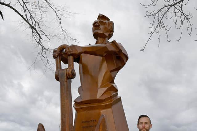 Luke Perry with the sculpture. Photo: Tim Thursfield